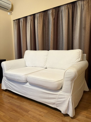 Two-seater sofa with white fabric cover like new