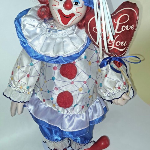 Porcelain clown doll like new, 40 cm with metal base