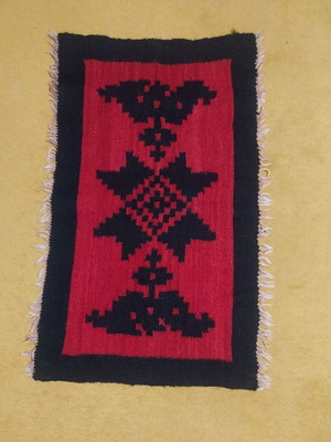 Wool woven rug used from the 1950s with traditional design