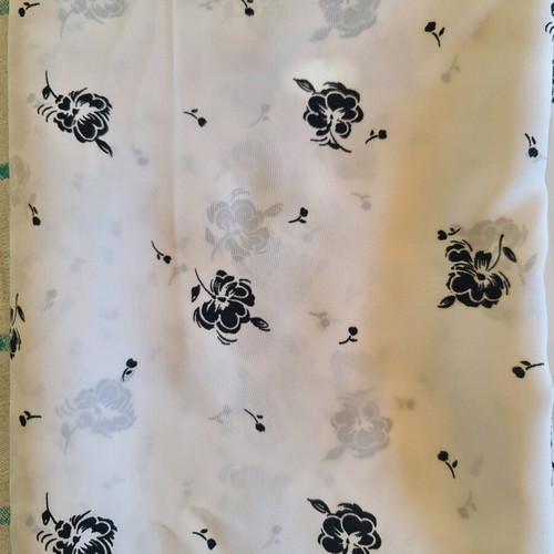 White fabric with black flowers for dress