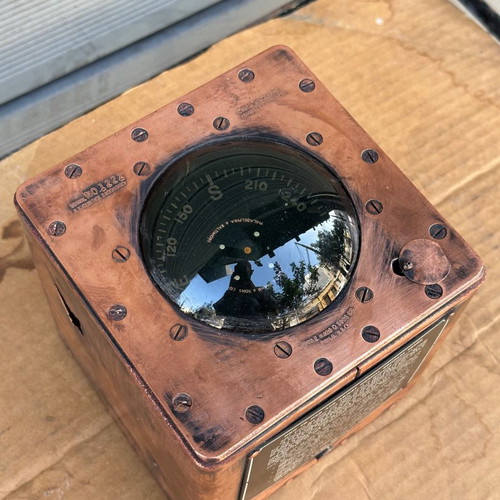 Old copper submarine compass used with artificial horizon