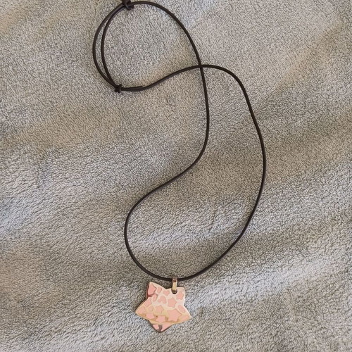 Necklace new with black elastic and silver ornament with pink details