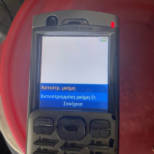 Sony Ericsson P 990i vintage mobile phone used with dock and charger