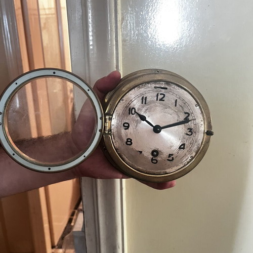 Vintage brass nautical ship clock, wall-mounted wind-up porthole style