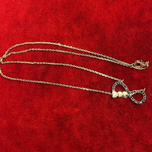 Silver 925 necklace with gold vermeil coating, infinity design with gold hearts, used