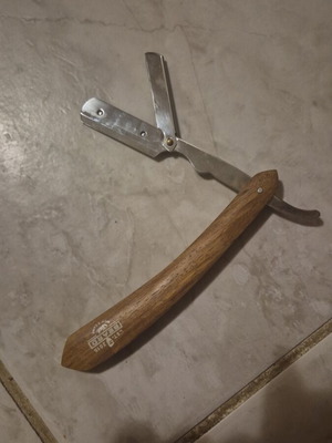 Brown straight razor made of stainless steel with removable blade like new