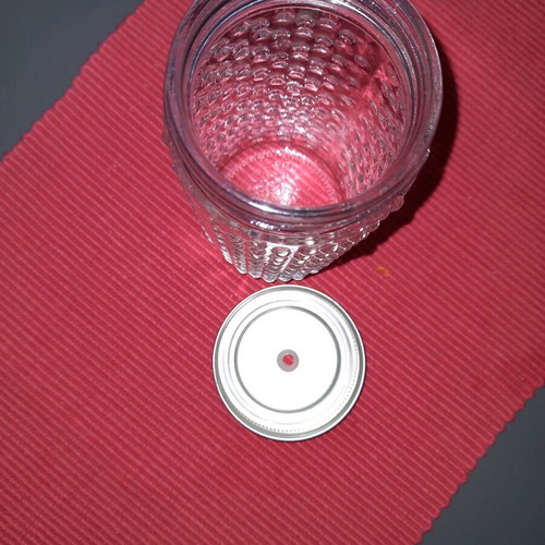 Large drink glass with hole for straw