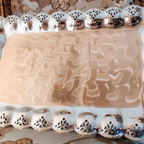 Metal serving platter used with beautiful decoration for desserts