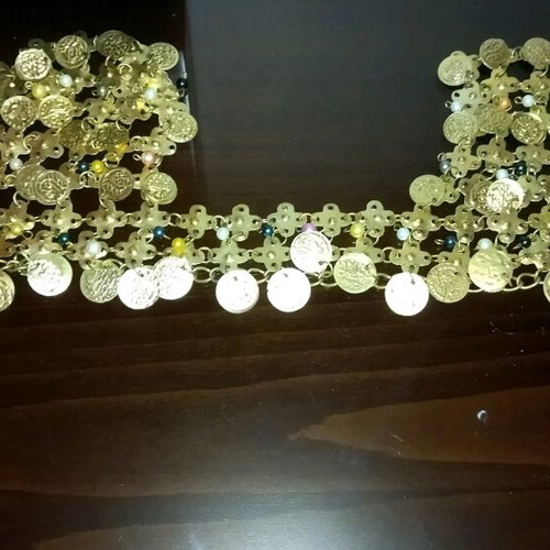 Genuine Khanoumisa belt like new, adjustable, gold-colored