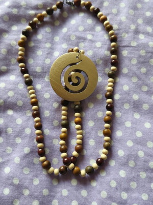 Wooden long boho necklace like new with gold pendant and brown beads