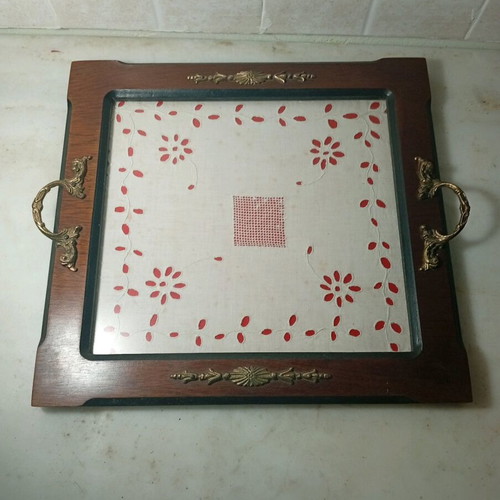 Traditional wooden serving tray used with handmade embroidery
