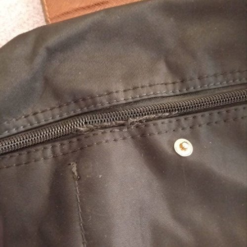 Black backpack with brown flap