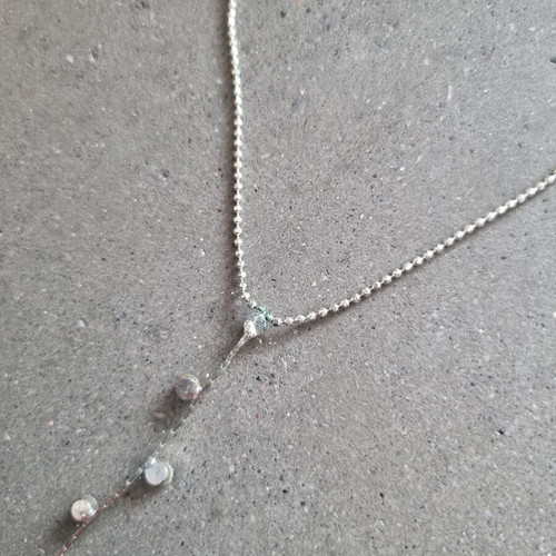 Necklace with hanging chain and stones