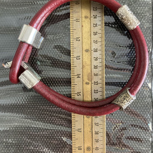 Leather cord bracelet with silver-tone metal accents