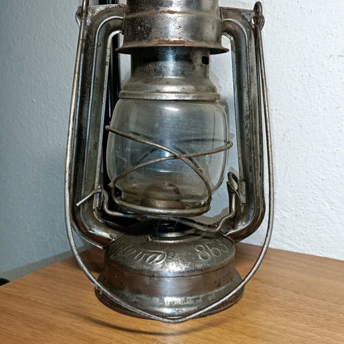 Vintage storm lantern used with cracked glass