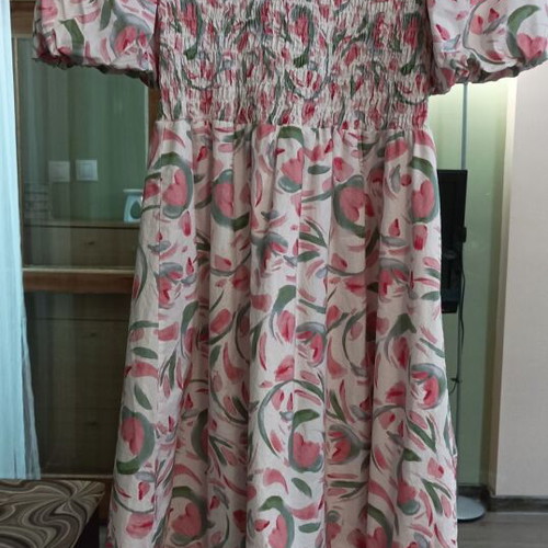 Long boho dress with floral print and smocked bodice