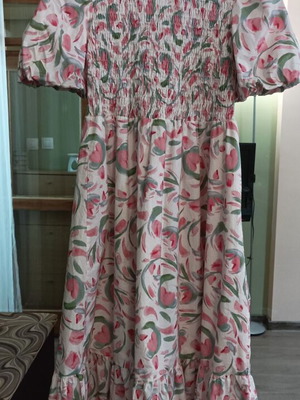 Long boho dress with floral print and smocked bodice