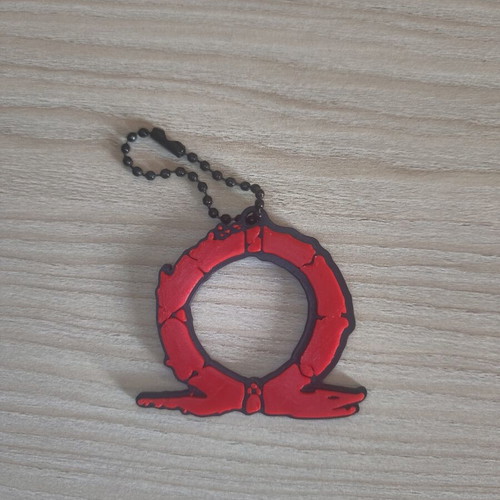 God of War keychain like new, black and red