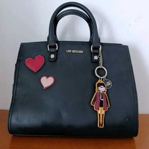 Love Moschino black hand bag like new with charms
