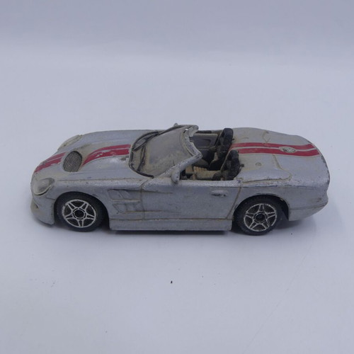 Ford Shelby Series 1 Burago Street Fire 1/43 used, silver with red stripes