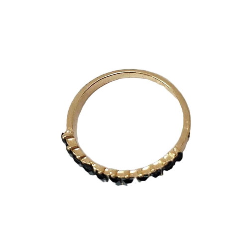 Eternity ring like new, gold color with black stones