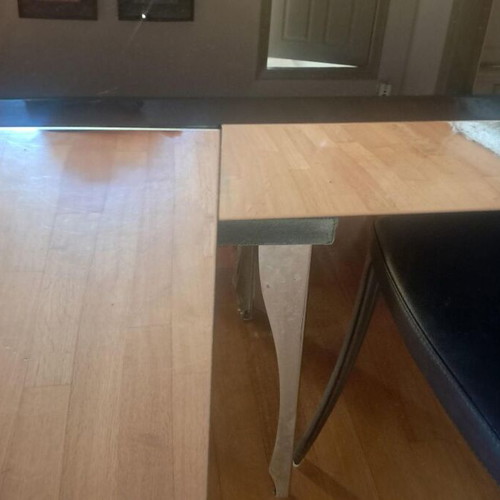 Room table with inox frame and black glass top, like new, with 4 chairs gift
