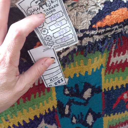 Oriental rug used, handmade with signature and authenticity label