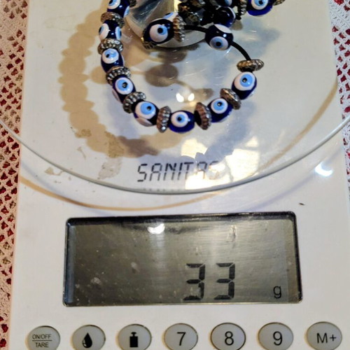 Worry beads with eye beads and metal