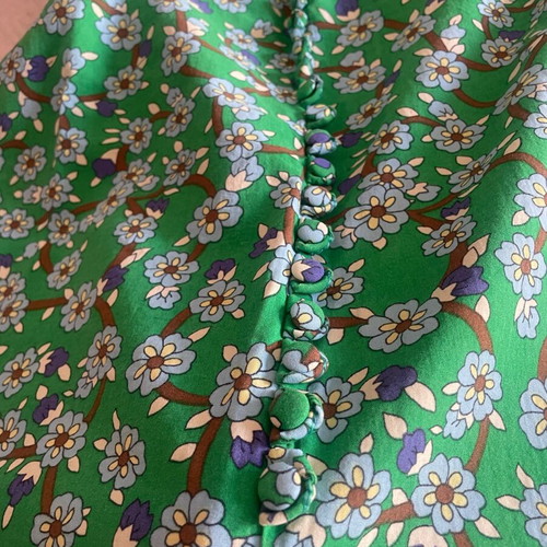 D&K skirt like new with front slit and decorative buttons, white and green
