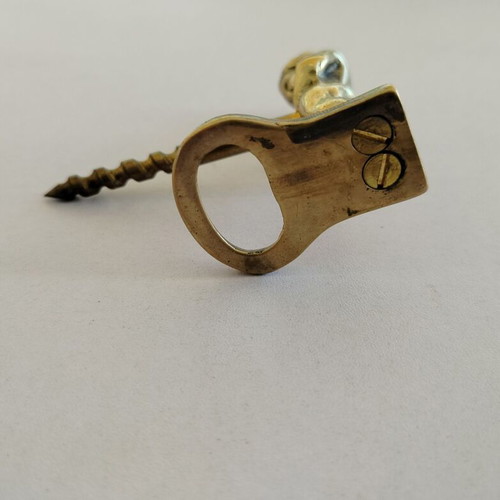 Brass corkscrew opener used with minor metal wear