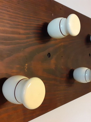Wooden wall hanger with handles from old barber shaving brushes