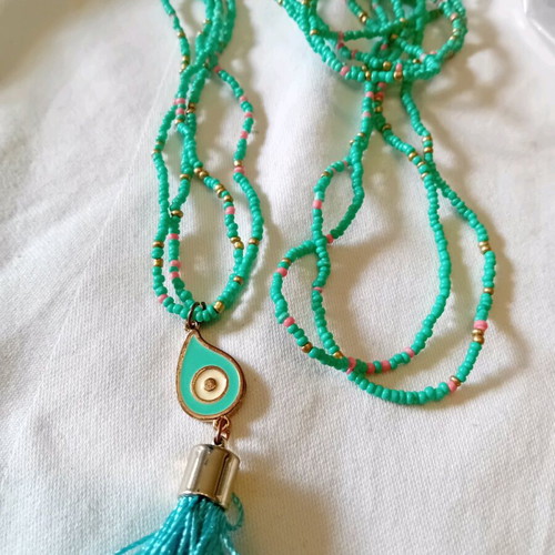 Long necklace like new with turquoise beads and eye-shaped pendant