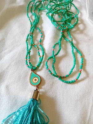 Long necklace like new with turquoise beads and eye-shaped pendant