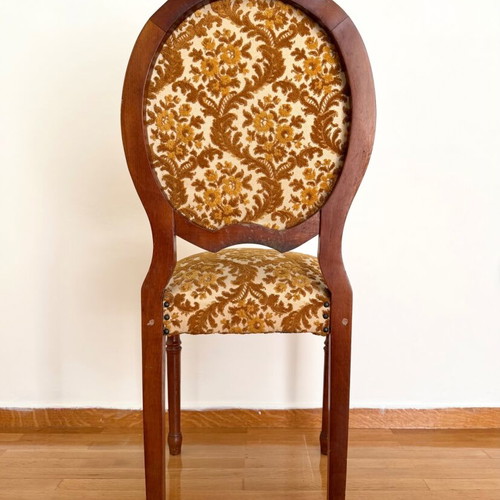 Chair used with wooden frame and brown velour fabric with floral pattern