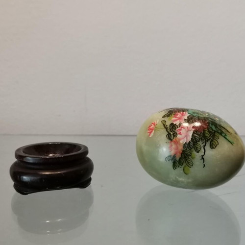 Asian marble egg used with hand-painted design and wooden base