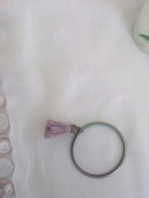 Handcuff bracelet like new with lavender tassel