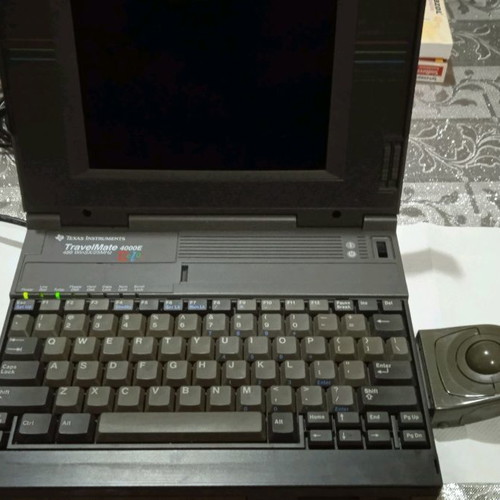 Texas Instruments vintage laptop used, 1980s with charger and mouse