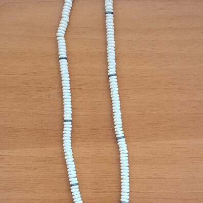 Necklace with white round beads and brown branch motif pendant like new