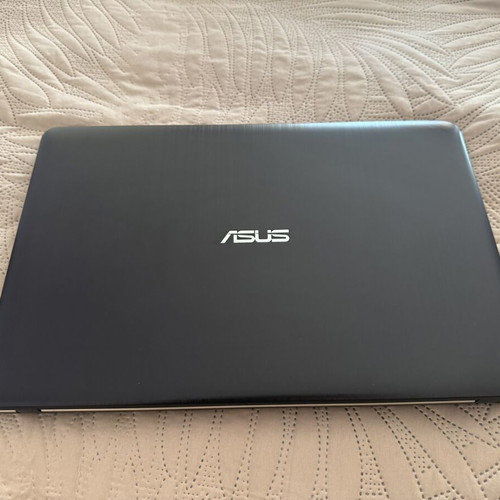 Asus VivoBook laptop with new charger, 15-inch, Intel Celeron, 4GB RAM