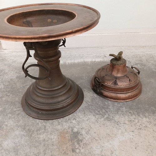 Old copper brazier used with brass handles and decorative bird