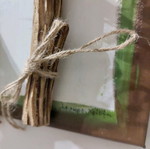 Handmade mixed media wall art with natural materials and metal leaves like new