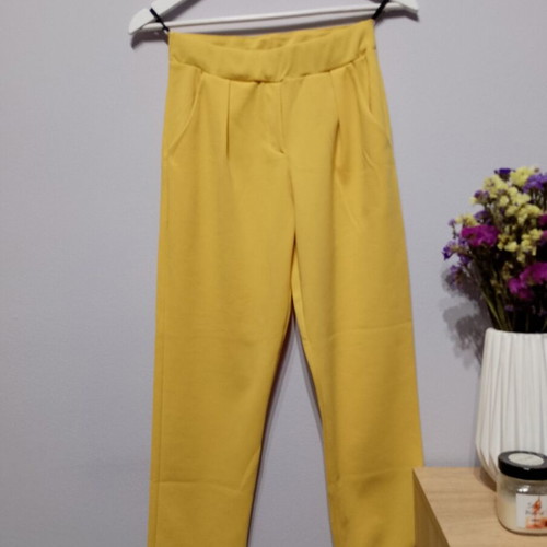 Yellow fabric pants used with elastic waist and pockets