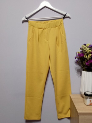 Yellow fabric pants used with elastic waist and pockets