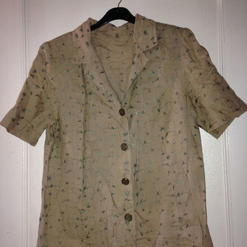 Suit with embroidered floral details like linen used
