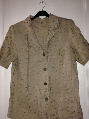 Suit with embroidered floral details like linen used