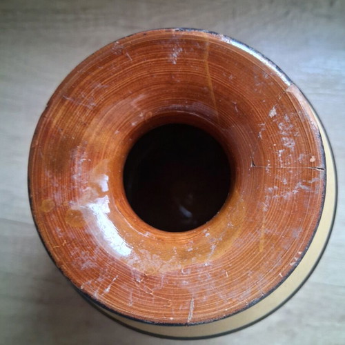 Clay vase used with repaired neck