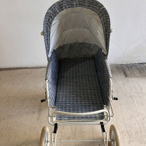 Vintage baby stroller with classic check fabric and metal frame