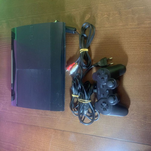 PlayStation 3 Super Slim 12 GB console like new with 4 games and controller