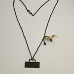 Vintage necklace with cassette player pendant and headphones used