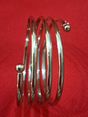 Spiral bracelet with small charm new, gold stainless steel by Krimson Klover